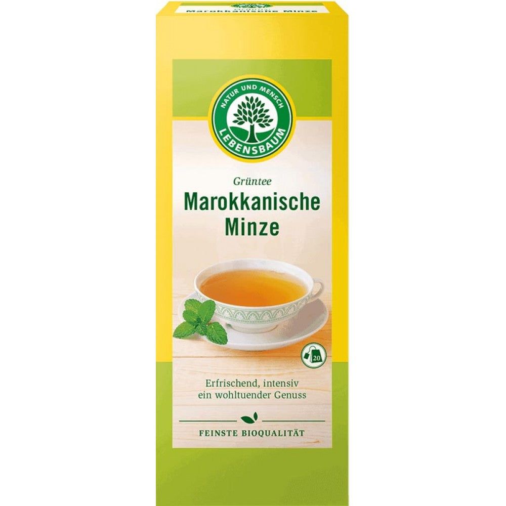 Cutie galbenă de ceai verde bio cu mentă marocană de 40g Lebensbaum, logo și ceai în ceașcă.