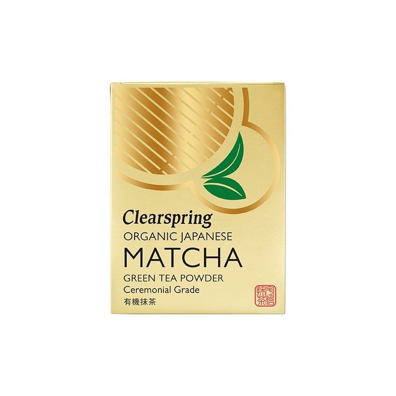 Ambalaj auriu cu detalii verzi și inscripții negre ale Ceaiului Verde Matcha Clearspring Eco.
