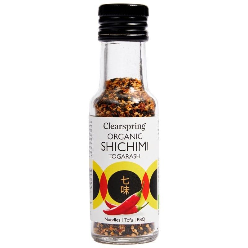 Mix 7 Condimente Japoneze Shichimi Togarashi Clearspring, sticlă transparentă, etichetă albă cu piper roșu.