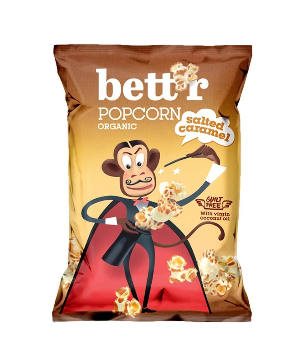 Pungă Bettr Popcorn caramel sărat bio 60g, design cu maimuță, ambalaj maro-galben.