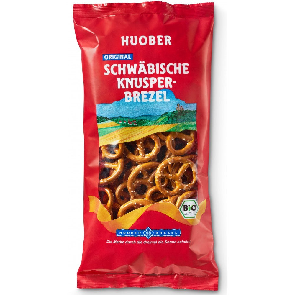 Covrigei crocanți Huober 175g în ambalaj roșu, ingrediente bio, imagine peisaj integral.