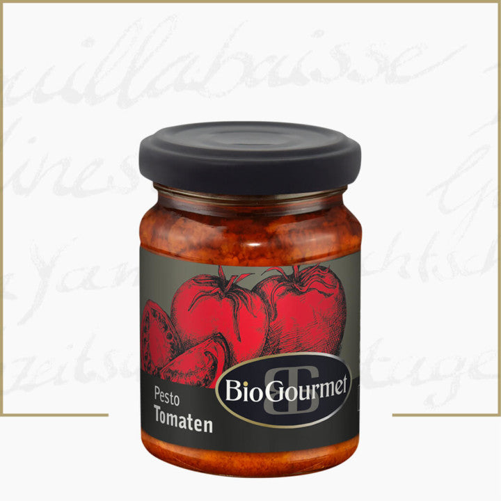 Pesto de roșii BioGourmet, 120g, etichetă cu roșii roșii, capac negru.