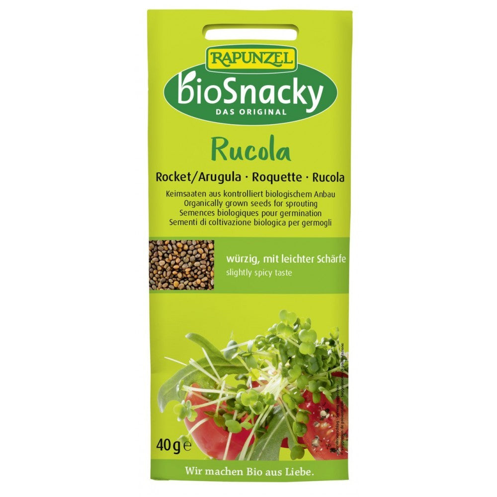 Semințe bio de rucola pentru germinat 40g BioSnacky Rapunzel, ambalaj verde, imagine planta germinată.