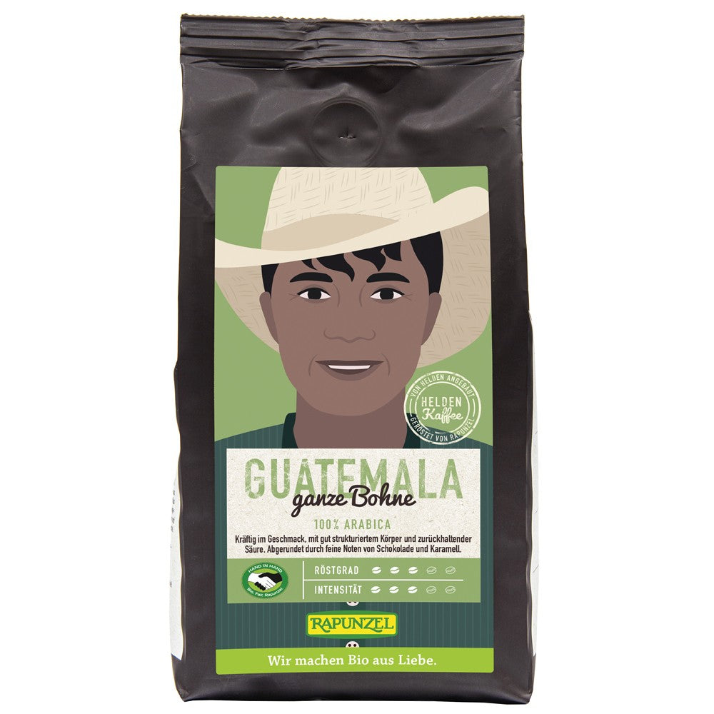Cafea Arabica boabe Guatemala Rapunzel 250g ambalaj negru cu eticheta verde și ilustrație.