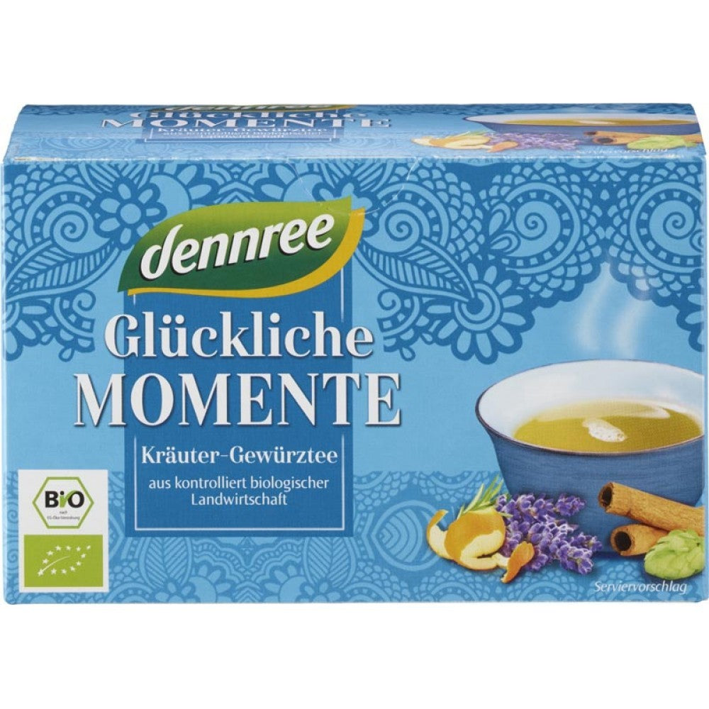 Ceai bio Momente fericite Dennree 40g, cutie albastră cu motive florale și imagine ceai cu ingrediente naturale.