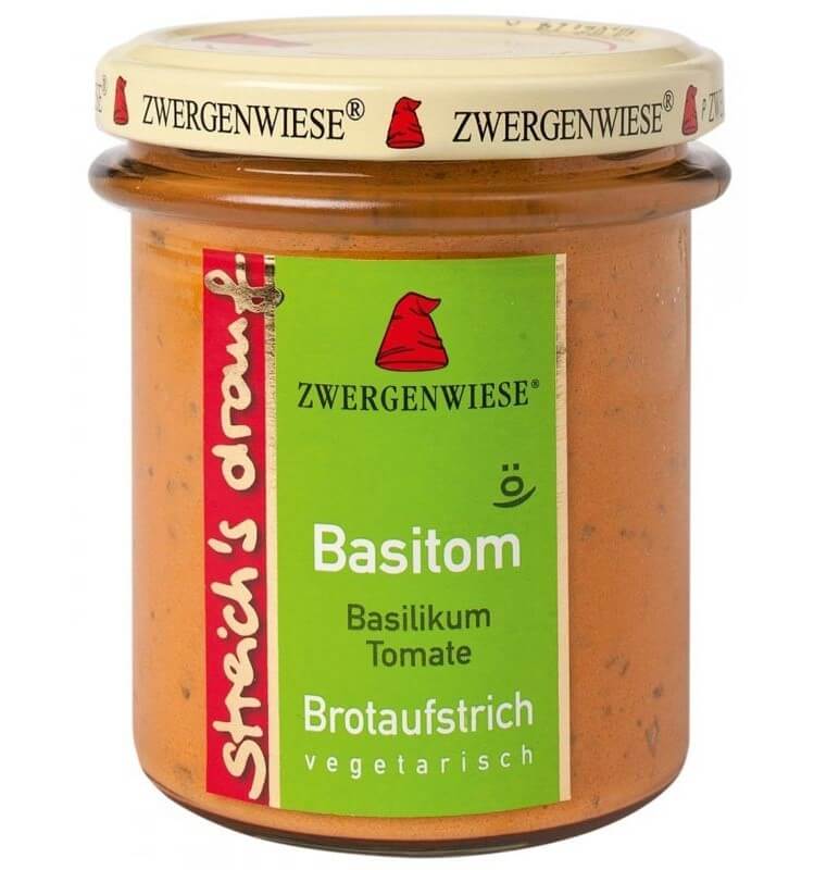 Crema tartinabilă Basitom cu busuioc și tomate în borcan de sticlă transparentă.