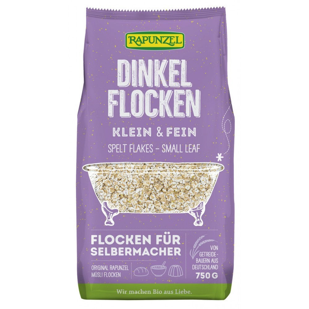 Fulgii mici de spelta bio Rapunzel 750g, pe fundal mov, design rustic cu detalii albe.