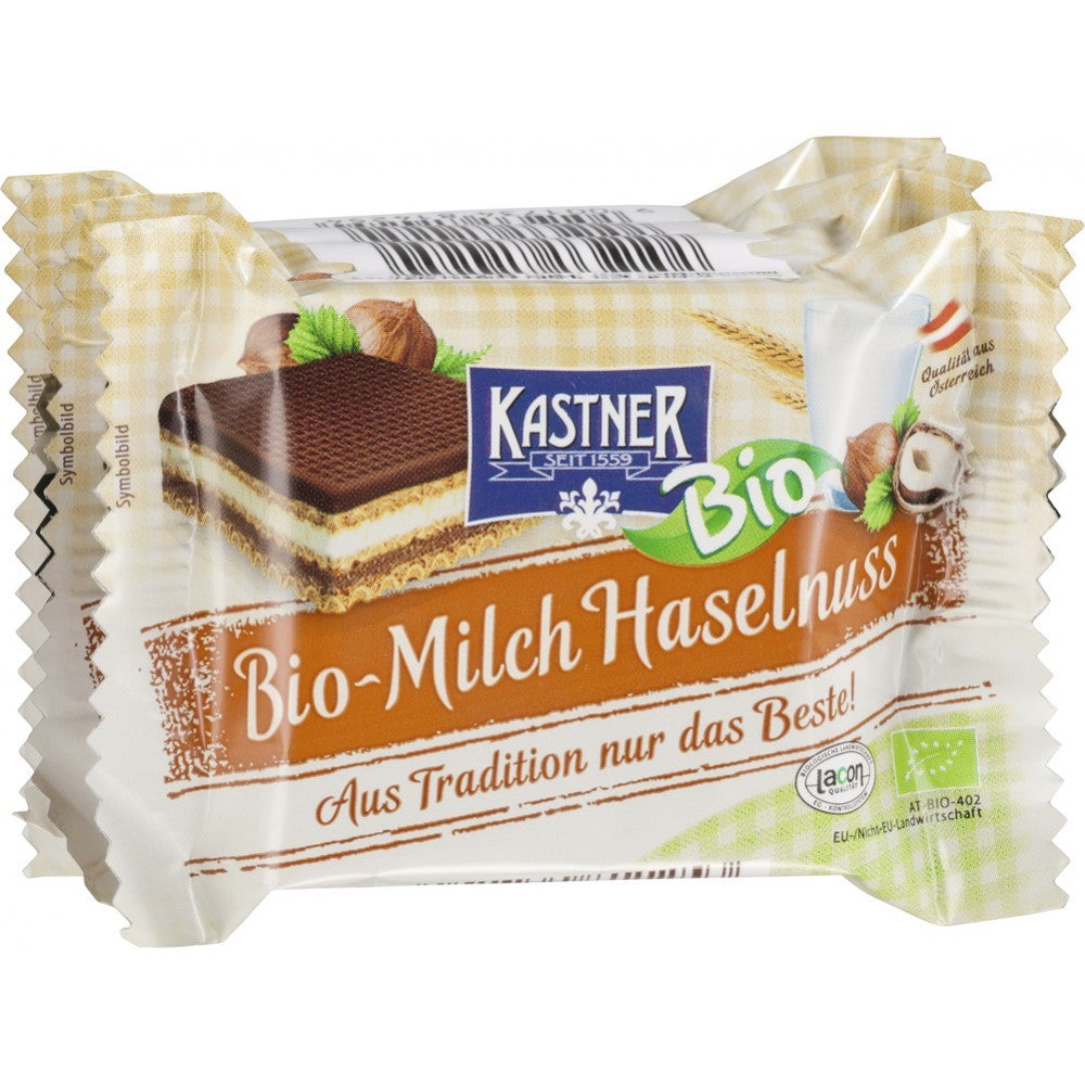 Napolitane bio Kastner cu lapte și alune, ambalaj 4x25g, ingrediente ecologice, design atractiv, etichetă maro.